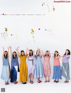 A group of young women standing next to each other.