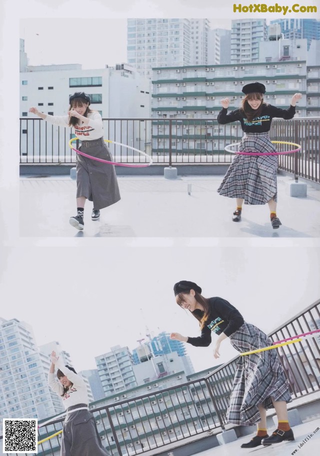 A woman is playing with a hula hoop on a rooftop.