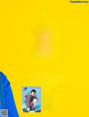A magazine with a woman in a blue sweater on the cover.
