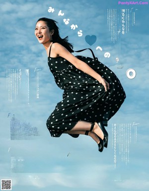 A woman in a pink dress is posing for a magazine.