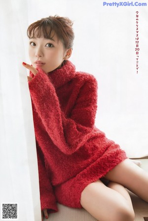 A magazine with a picture of a woman in a fur coat.