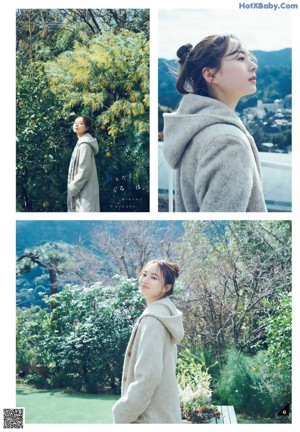 A woman standing on the side of a road next to a tree.