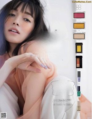 A magazine spread with a woman's face and makeup products.