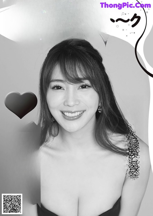 A black and white photo of a woman in a black dress.