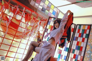 A woman in a kimono is posing for a picture.