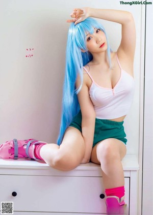A woman with blue hair and pink roller skates on a magazine cover.