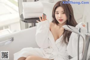 a woman in a white lingerie sitting on a table